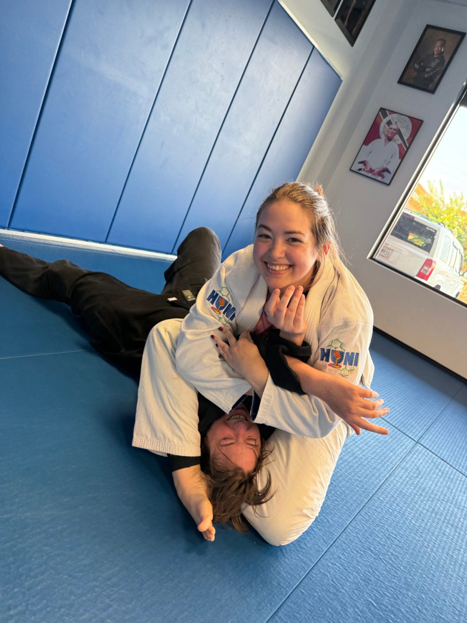 Two training partners mid-throw during jiu-jitsu class